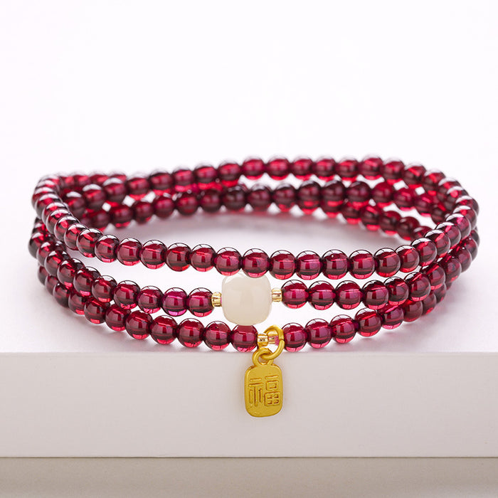 Garnet Wrap Bracelet with Jade-Style Accent · Fu Tag or Lock Charm