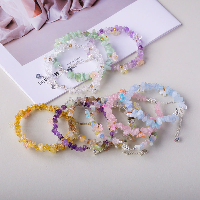 Original crystal-chip bracelet with decorative flower accents; physical product photograph preserved