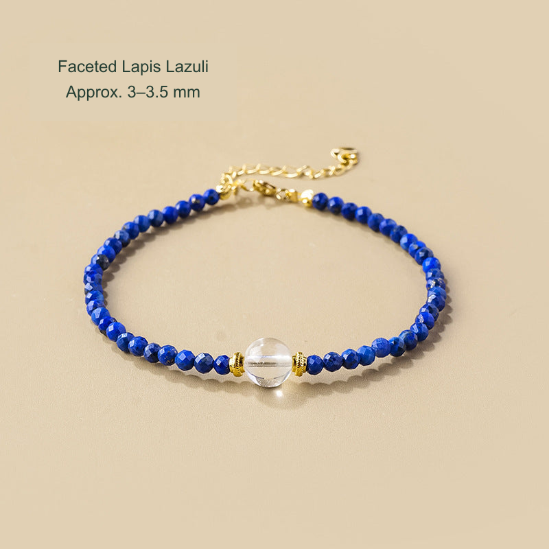 Faceted lapis bracelet with clear focal bead; supplier photo labels approximately 3–3.5 mm beads