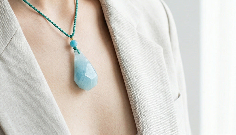 Original aquamarine necklace wearing photograph cropped above supplier text; physical product preserved