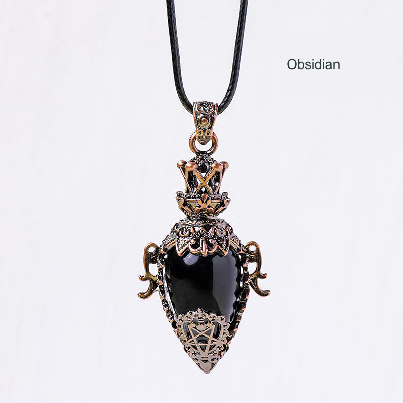 Ornate antique-bronze-color stone pendant; original photograph with English material label.
