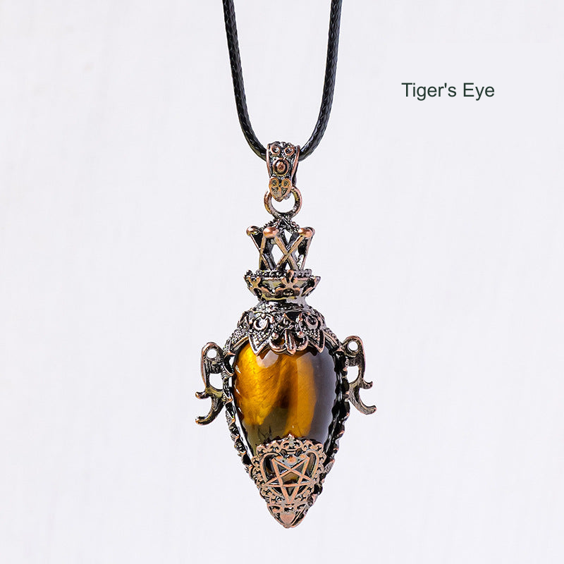 Ornate antique-bronze-color stone pendant; original photograph with English material label.