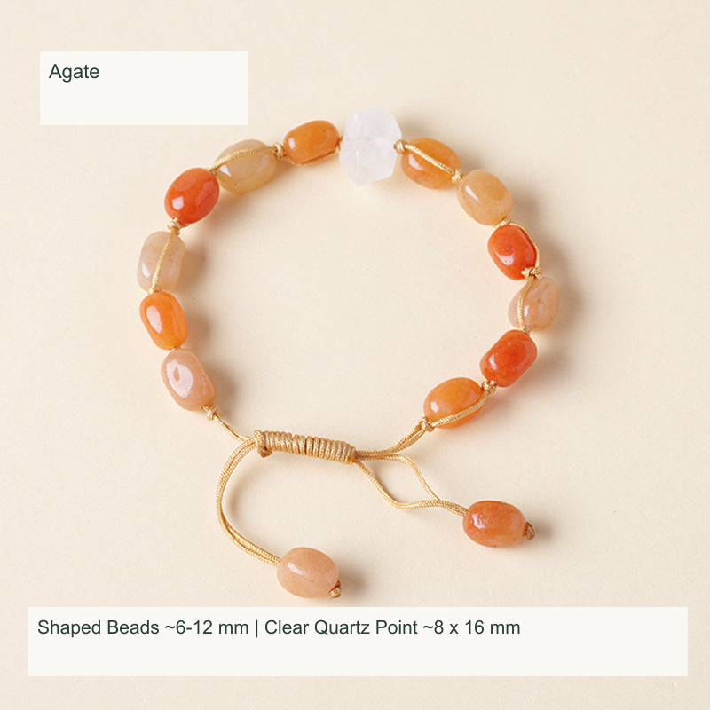 Original double-point quartz and shaped stone cord bracelet with English supplier material and size labels; product unchanged