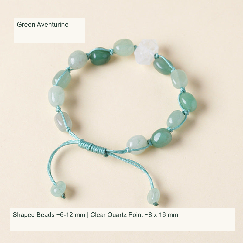 Original double-point quartz and shaped stone cord bracelet with English supplier material and size labels; product unchanged