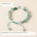 Original double-point quartz and shaped stone cord bracelet with English supplier material and size labels; product unchanged