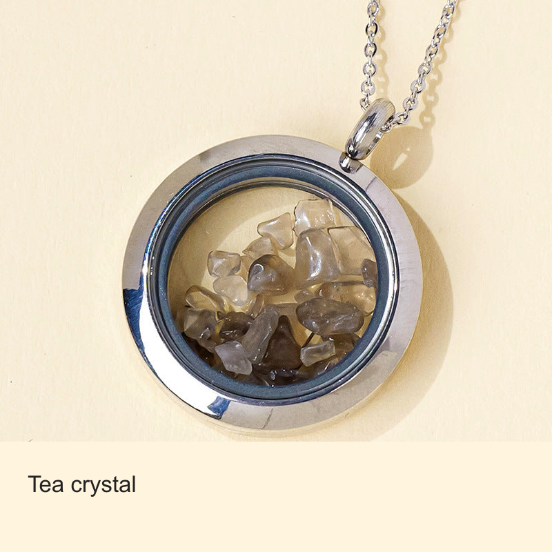Original stone-filled circular pendant photo with equivalent English label; real contents, frame and chain unchanged