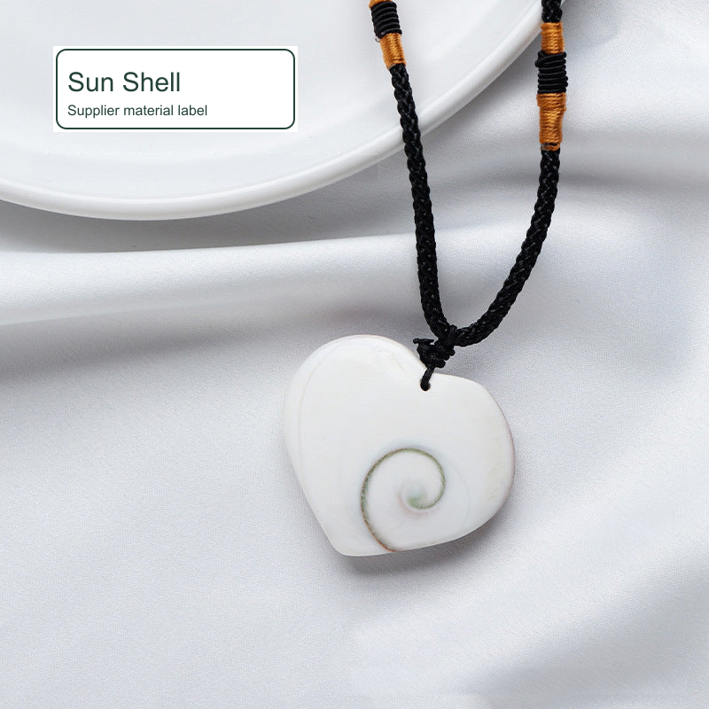 Heart-shaped cord necklace — photo label Sun Shell; SKU Sunshell