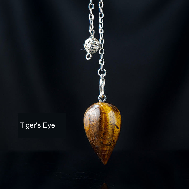 Tiger's Eye teardrop pendulum with English material label, original product photograph
