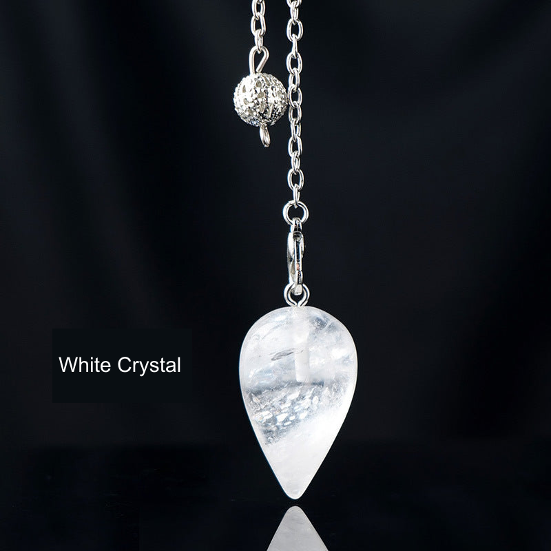 White Crystal teardrop pendulum with English material label, original product photograph