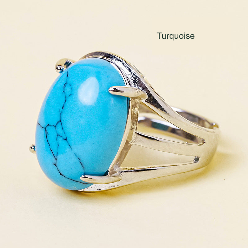 Turquoise oval ring, unchanged original product photograph with English material label