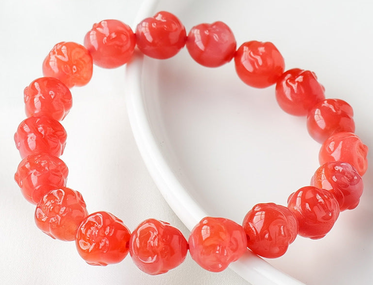 Actual Red Agate Buddha-head bead bracelet, clean original photograph crop