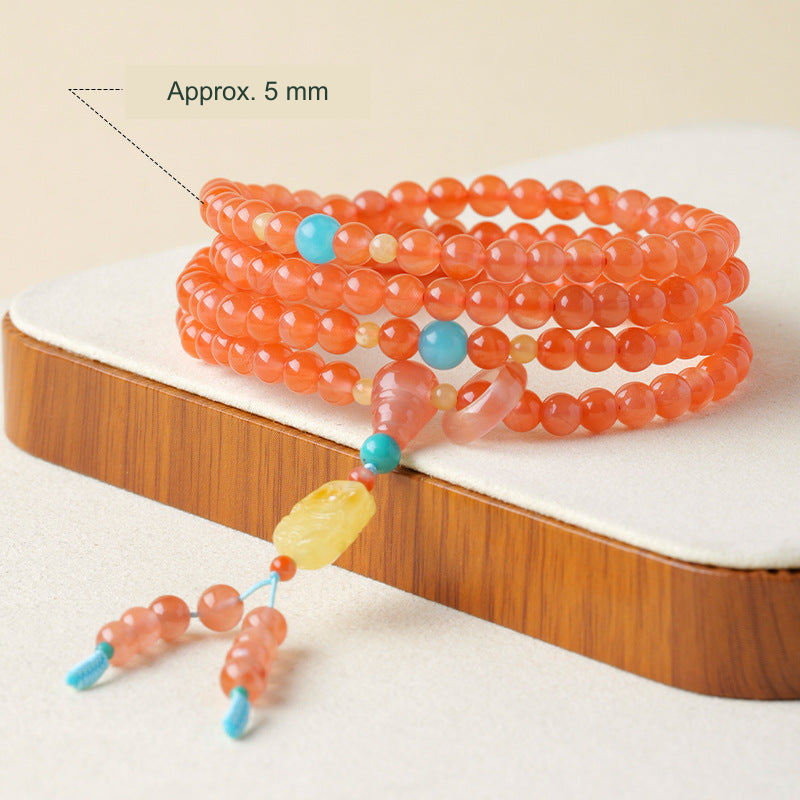 Red agate supplier-described wrap bracelet with tassel, approximately 5 mm beads