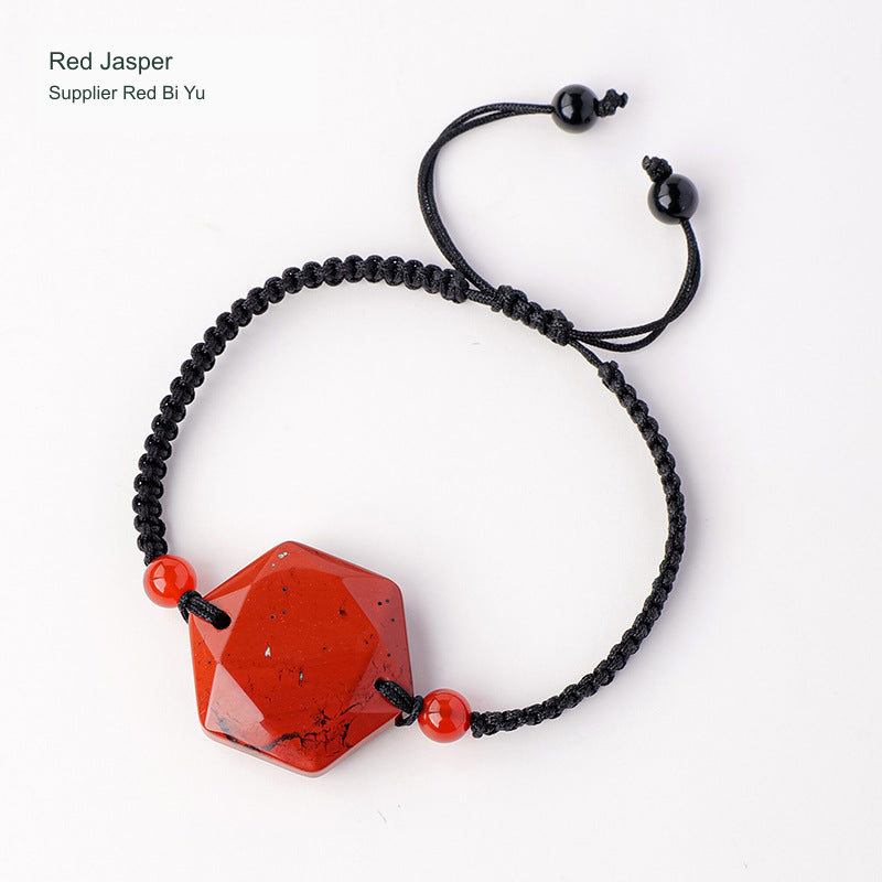 Original faceted geometric stone cord bracelet with English supplier material label; physical bead and cord unchanged