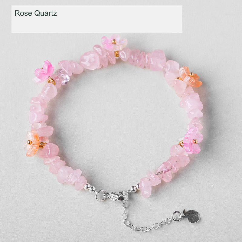 Original crystal-chip bracelet with decorative flower accents; physical product photograph preserved