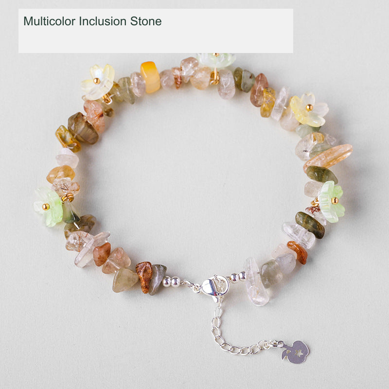 Original crystal-chip bracelet with decorative flower accents; physical product photograph preserved