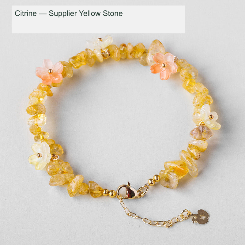 Original crystal-chip bracelet with decorative flower accents; physical product photograph preserved