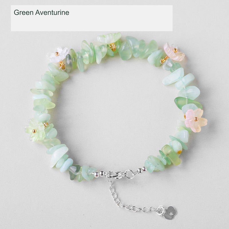 Original crystal-chip bracelet with decorative flower accents; physical product photograph preserved