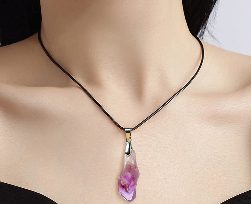 Original tooth-shaped pendant photograph; product unchanged