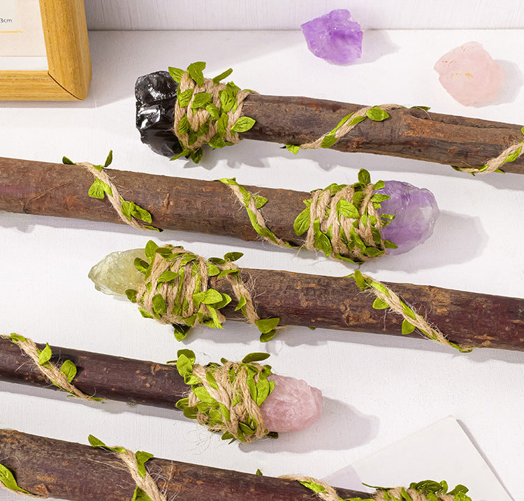 Original close-up of rough stone ends, wood-like handles and decorative leaf wrapping